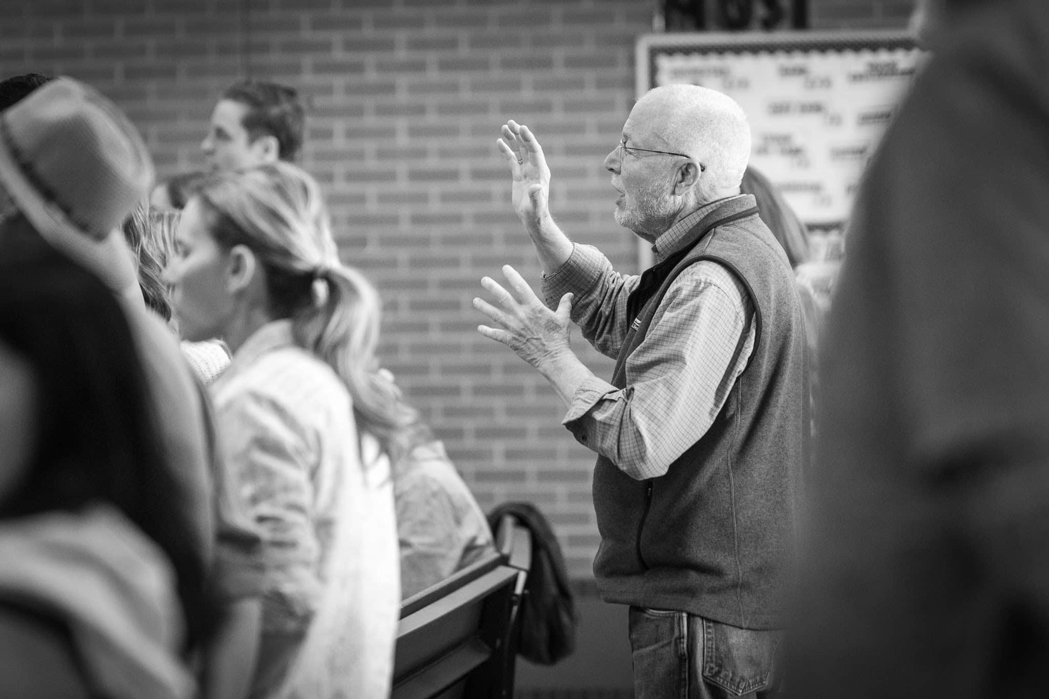 Man Lifting Hands in Worship Man lifting hands in worship during a church service at Redeemer Longmont